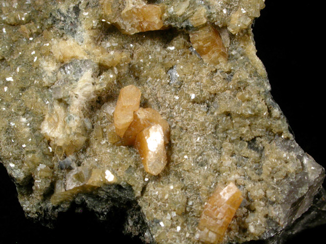 Heulandite crystals up to 5 mm long from 4th Ave. at 82nd Street, Manhattan, NY. 