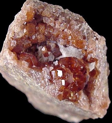 Mineral Specimens: Essonite Garnet from Road cut west of train station, West Redding, Connecticut